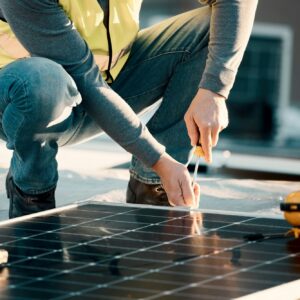 Solar panel, screwdriver and industrial worker hands with tools for renewable energy and electricit